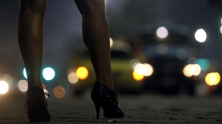 Prostitute at Atlantica avenue in copacabana beach, Rio de Janeiro